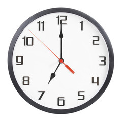 Wall clock isolated on white background. 7 p.m. or 7 a.m.