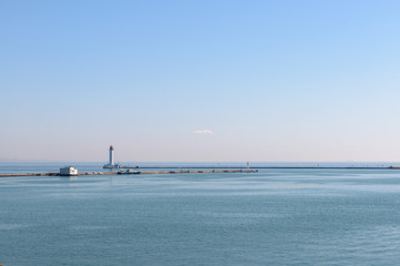 Obraz premium Sea surface and lighthouse