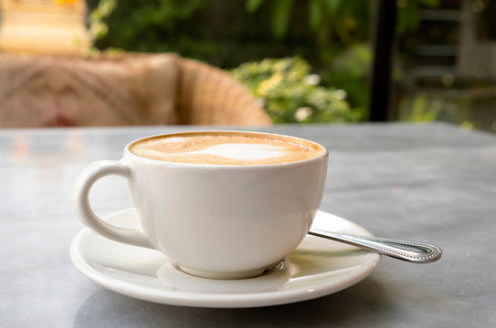 Aromatic latte coffee on the marble table