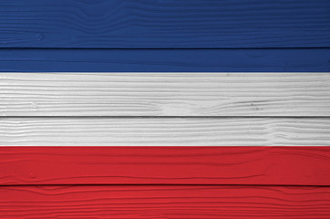 Yugoslavia (1918–1941) flag color painted on Fiber cement sheet wall background.