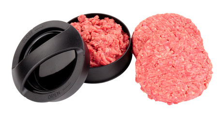 Burger press and freshly made burgers isolated on a white background