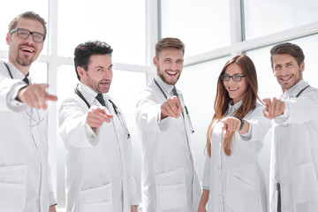 Fototapeta na wymiar group of practicing doctors pointing their finger at you