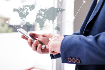 businessman choosing business trip from the mobile phone