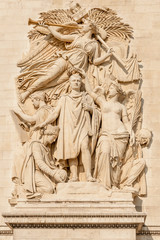 Fototapeta na wymiar Famous Arc de Triomphe (Triumphal Arch) pillar relief featuring Napoleon relief called Triumph of 1810, Paris, France