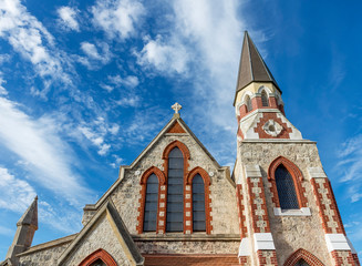 Fototapeta na wymiar Detail of The beautiful Scots Presbyterian Church, Fremantle, Western Australia against a dramatic sky