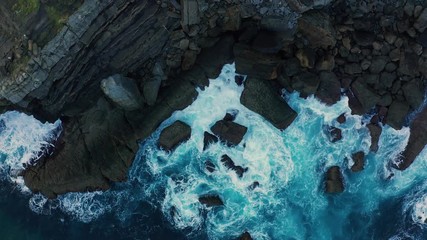 Up travelling shot of sea waves colors breaking in the coast of Lekeitio #LK010, Basque country - drone aerial 4k footage graded (ungraded version available)