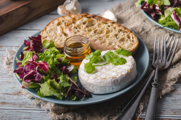 Grilled camembert cheese with honey