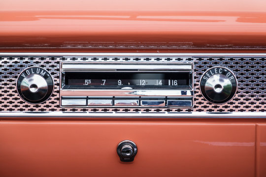Old classic car radio in the dashboard
