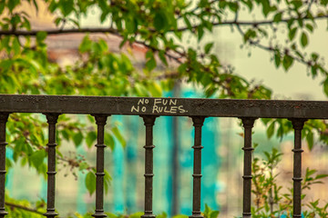 no fun no rules graffiti in prague over defocused background