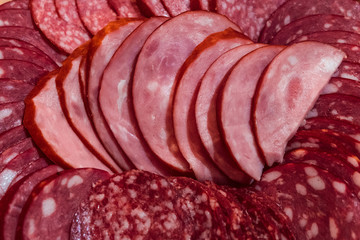 Sliced smoked and cooked smoked sausages close-up