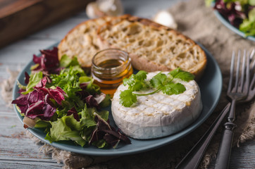 Grilled camembert cheese with honey