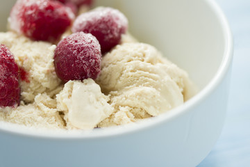  homemade ice cream with frozen cherry and raspberry .   healthy sweets concept