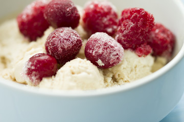  homemade ice cream with frozen cherry and raspberry .   healthy sweets concept