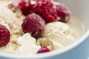  homemade ice cream with frozen cherry and raspberry .   healthy sweets concept