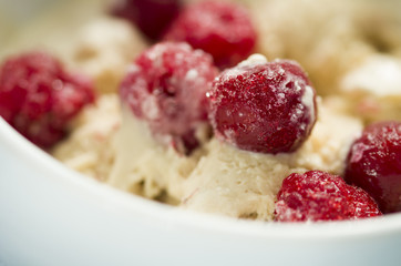  homemade ice cream with frozen cherry and raspberry .   healthy sweets concept