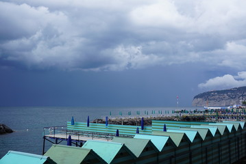 storm clouds approaching the sheds by the oean