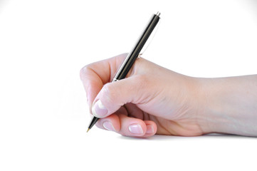 man's hand holding a pen and writing in a notebook