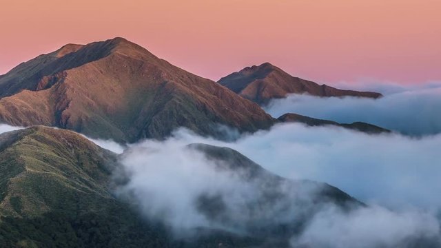 Sunrise in mountains nature above clouds in New Zealand landscape Time lapse