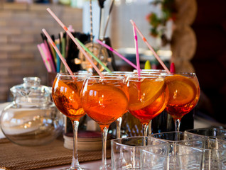 glasses of alcohol cocktail with straws