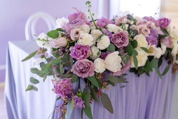 Big volume composition from fresh flowers. Wedding floristics with emphasis on lilac flowers