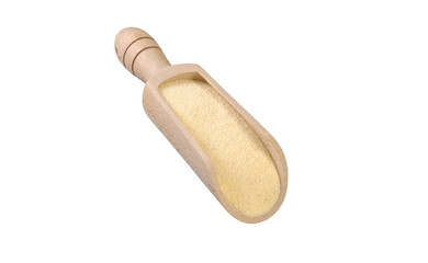 semolina in wooden scoop isolated on white background. nutrition. bio. natural food ingredient.
