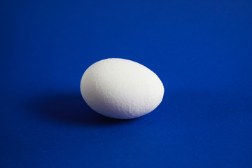 Close up of isolated egg with blue background