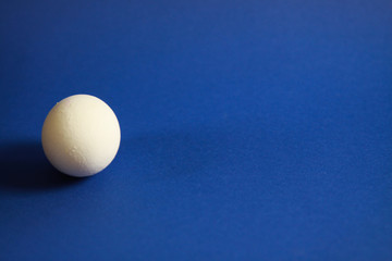Close up of isolated egg with blue background