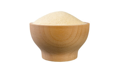 semolina in wooden bowl isolated on white background. nutrition. food ingredient.front view.