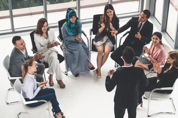 Businesswomen and businessmen attending group meeting conference in office room. Corporate business team concept.
