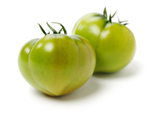 fresh green tomato isolated on white background