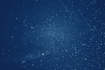 Vintage blue background. Rough painted wall of sapphire color. Imperfect plane of blue colored. Uneven old decorative toned backdrop of cyan tint. Texture of sapphirine hue. Ornamental stony surface.