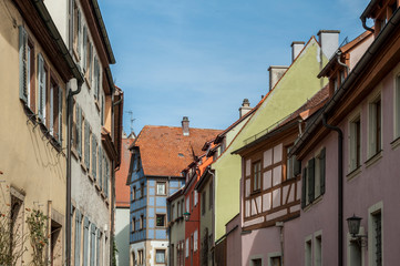 Fototapeta na wymiar ROTHENBURG OB DER TAUBER, GERMANY - MARCH 05, 2018: Historic colorful half-timbered houses in the medieval town Rothenburg ob der Tauber, one of the most beautiful villages in Europe, Germany