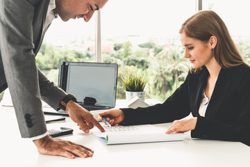 Architect and engineer working with construction drawing project on table in office. Architecture...