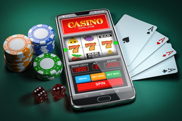 Online casino and gambling concept. Slot machine on smartphone screen, cards, dice and poker chips.