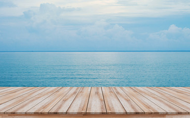 Fototapeta na wymiar Empty wooden pier with beautiful blue sea background for montage products display