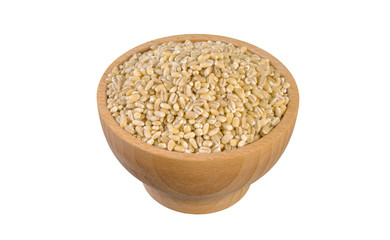 pearl barley in wooden bowl isolated on white background. nutrition. food ingredient.