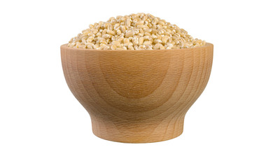 pearl barley in wooden bowl isolated on white background. nutrition. food ingredient.front view.