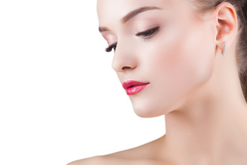 Fototapeta premium Beauty portrait. Young beautiful blond woman on isolated background. Attractive female on white background. Lady demonstrates makeup