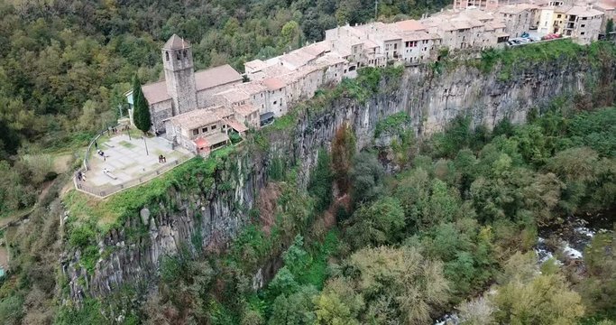 Aerial view of Castellfollit de la Roca, medieval Catalan hamlet on cliff on autumn day