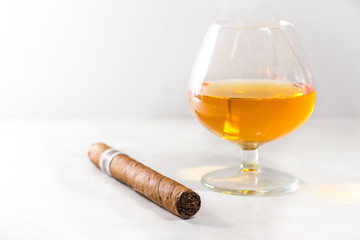 glass of whiskey and cigar