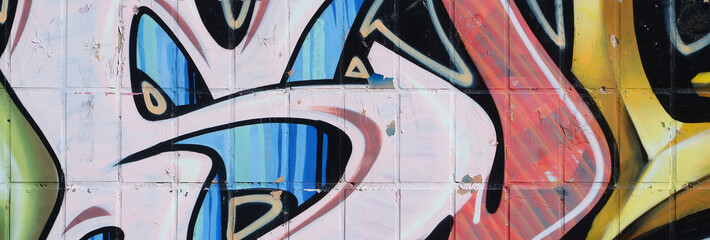 Fragment of colored street art graffiti paintings with contours and shading close up