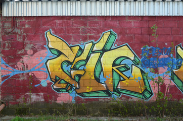 Fragment of colored street art graffiti paintings with contours and shading close up