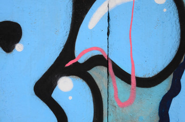 Fragment of colored street art graffiti paintings with contours and shading close up