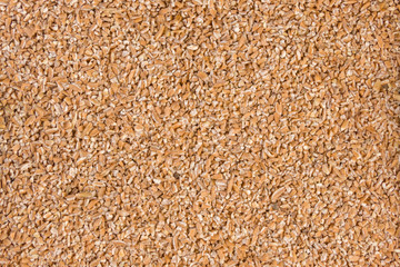 crushed spelt texture background. nutrition. bio. natural food ingredient.