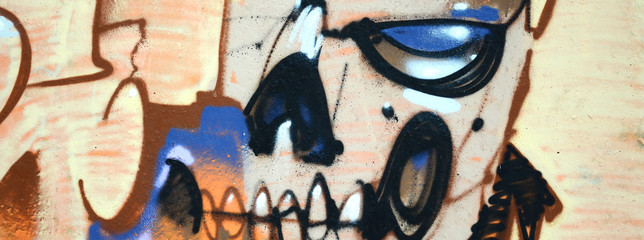 Fragment of colored street art graffiti paintings with contours and shading close up