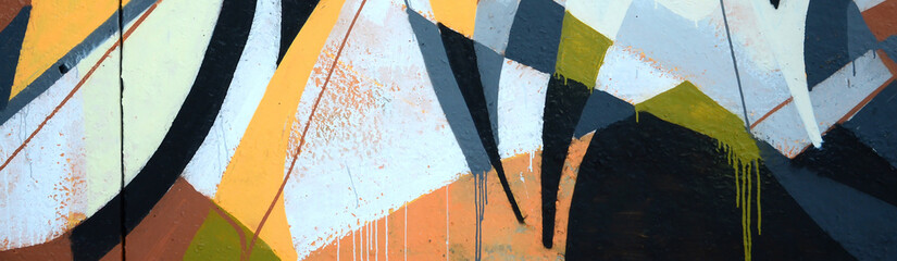 Fragment of colored street art graffiti paintings with contours and shading close up