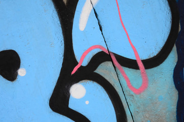 Fragment of colored street art graffiti paintings with contours and shading close up