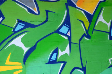 Fragment of colored street art graffiti paintings with contours and shading close up
