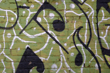Fragment of colored street art graffiti paintings with contours and shading close up