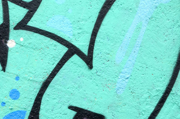 Fragment of colored street art graffiti paintings with contours and shading close up